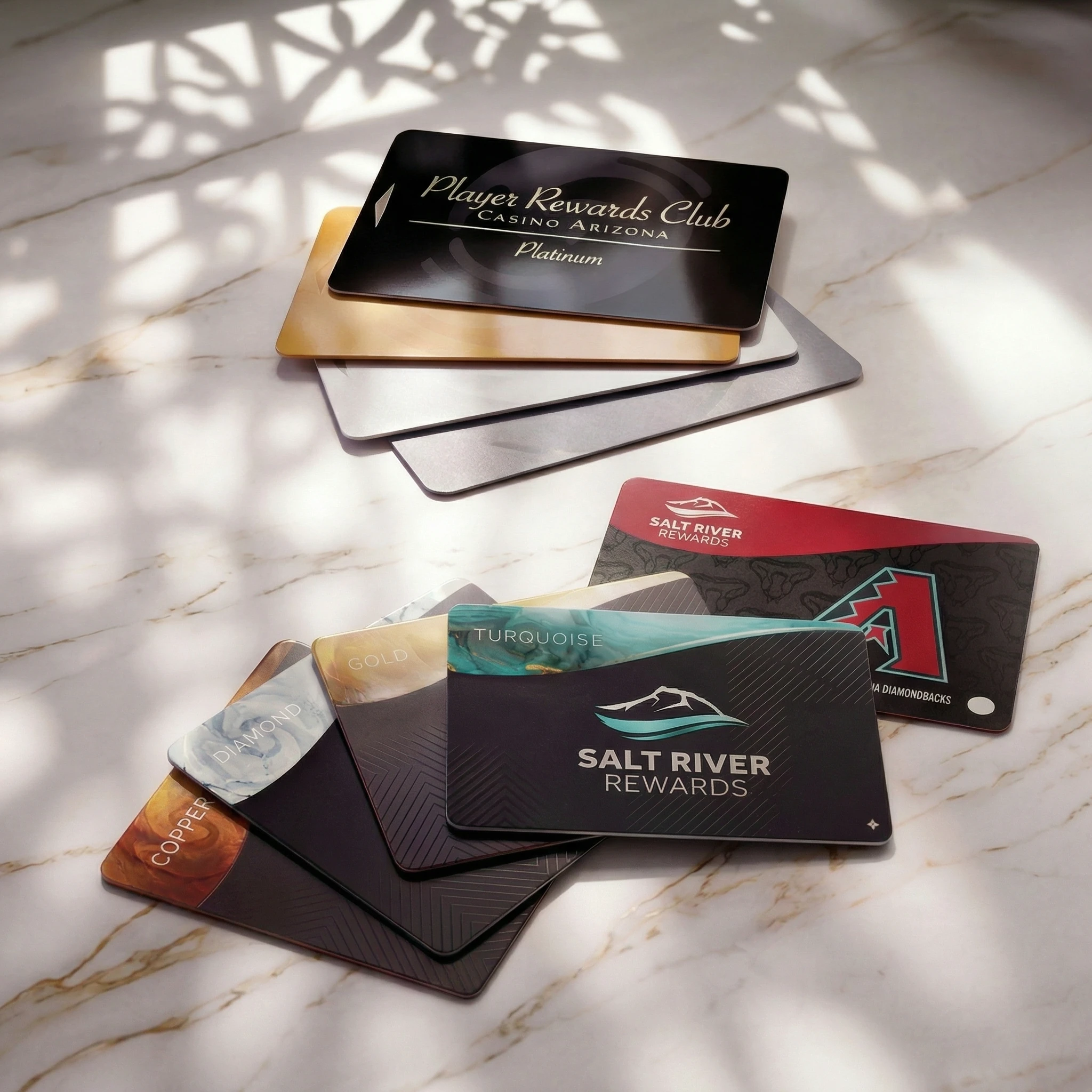 Before and after loyalty card designs showing the shift from Player Rewards Club to Salt River Rewards